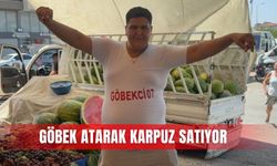 Göbek atarak karpuz satıyor