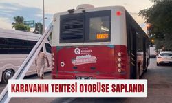 Karavanın tentesi otobüse saplandı