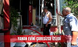Yanan evini çaresizce izledi