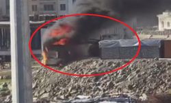 Alevlerin arasına dalan operatör, konteyneri uçurumdan yuvarladı