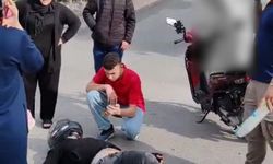 Sürücüsü ve çocuğunun korktuğunu görünce kendi acısını bir kenara attı