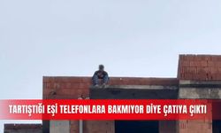 Tartıştığı eşi telefonlara bakmıyor diye çatıya çıktı