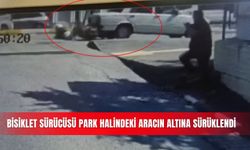 Bisiklet sürücüsü, park halindeki aracın altına sürüklendi