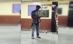 Hindistan'da başına pala saplanan genç telefon kullanmaya devam etti