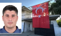 Şehit polis memurunun babaevine Türk bayrağı asıldı