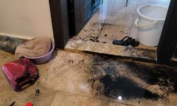 Tartıştığı eski kız arkadaşının apartmandaki dairesinin kapısını benzinle ateşe verdi