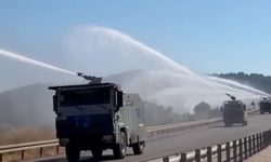 Peş peşe sıralanan TOMA'lar alevlere karşı