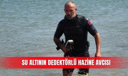 Su altının dedektörlü hazine avcısı
