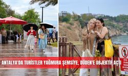 Antalya’da turistler yağmura şemsiye, Düden’e objektif açtı