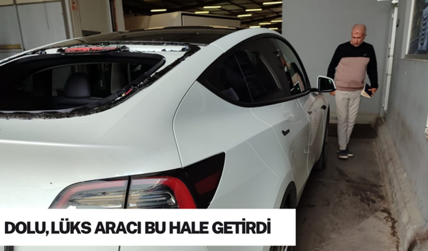 Serik’te dolu yağışı lüks otomobilin camlarını kırdı
