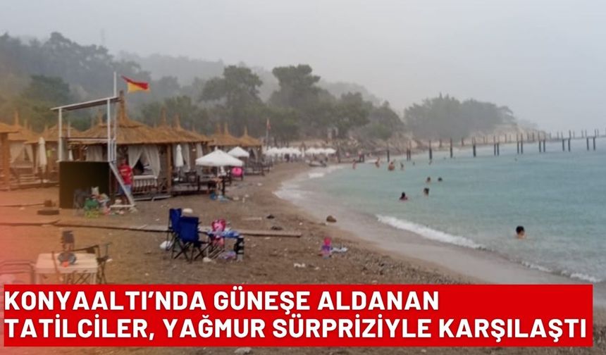 Konyaaltı’nda güneşe aldanan tatilciler, yağmur sürpriziyle karşılaştı