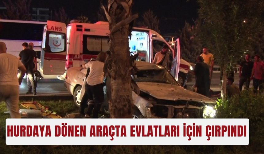 Hurdaya dönen araçta evlatları için çırpındı