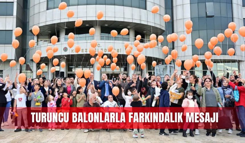 Turuncu balonlarla  farkındalık mesajı