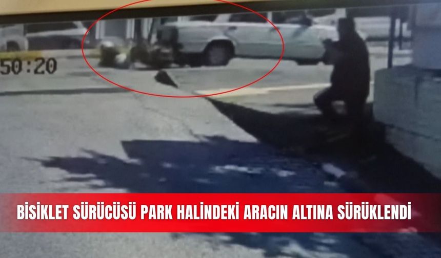 Bisiklet sürücüsü, park halindeki aracın altına sürüklendi